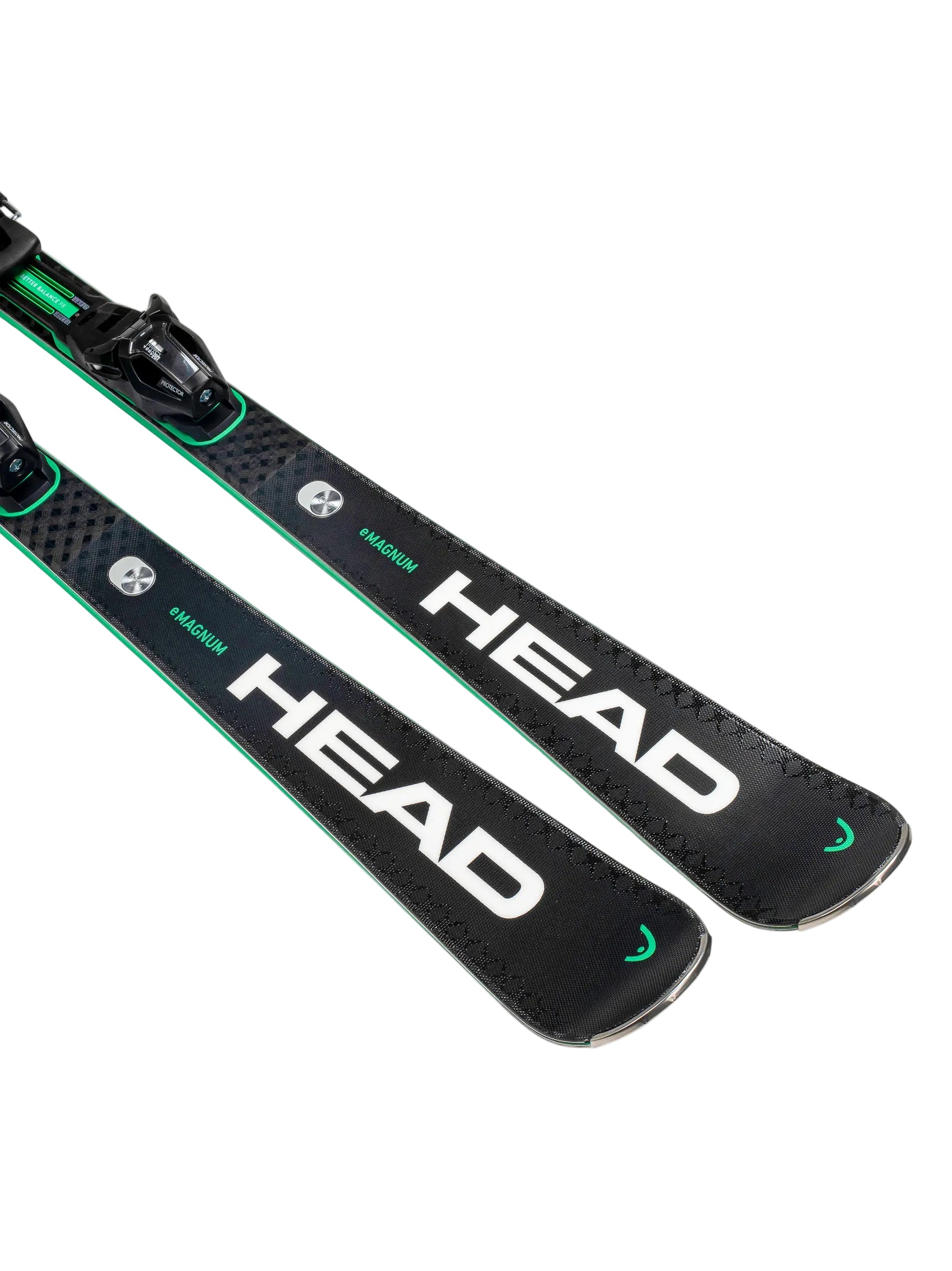Two black Head skis with green accents on a white background