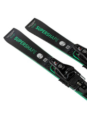 Two black and green skis with bindings on a white background