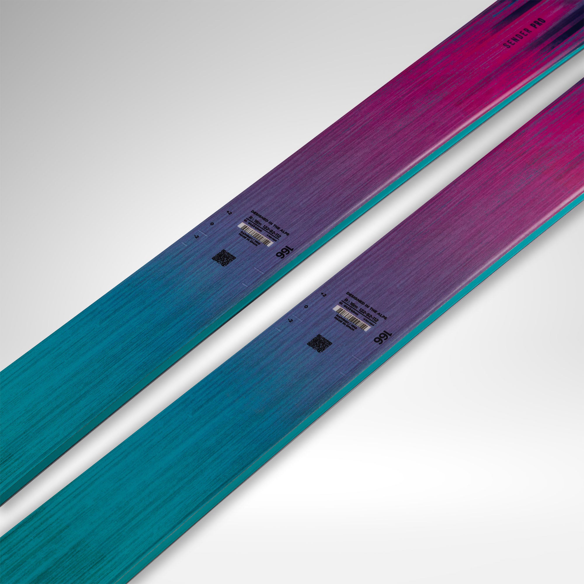 Rossignol Sender pro 2027 skis shown diagonally on a light gray background, featuring a vibrant color gradient that transitions from teal blue to purple and magenta pink.